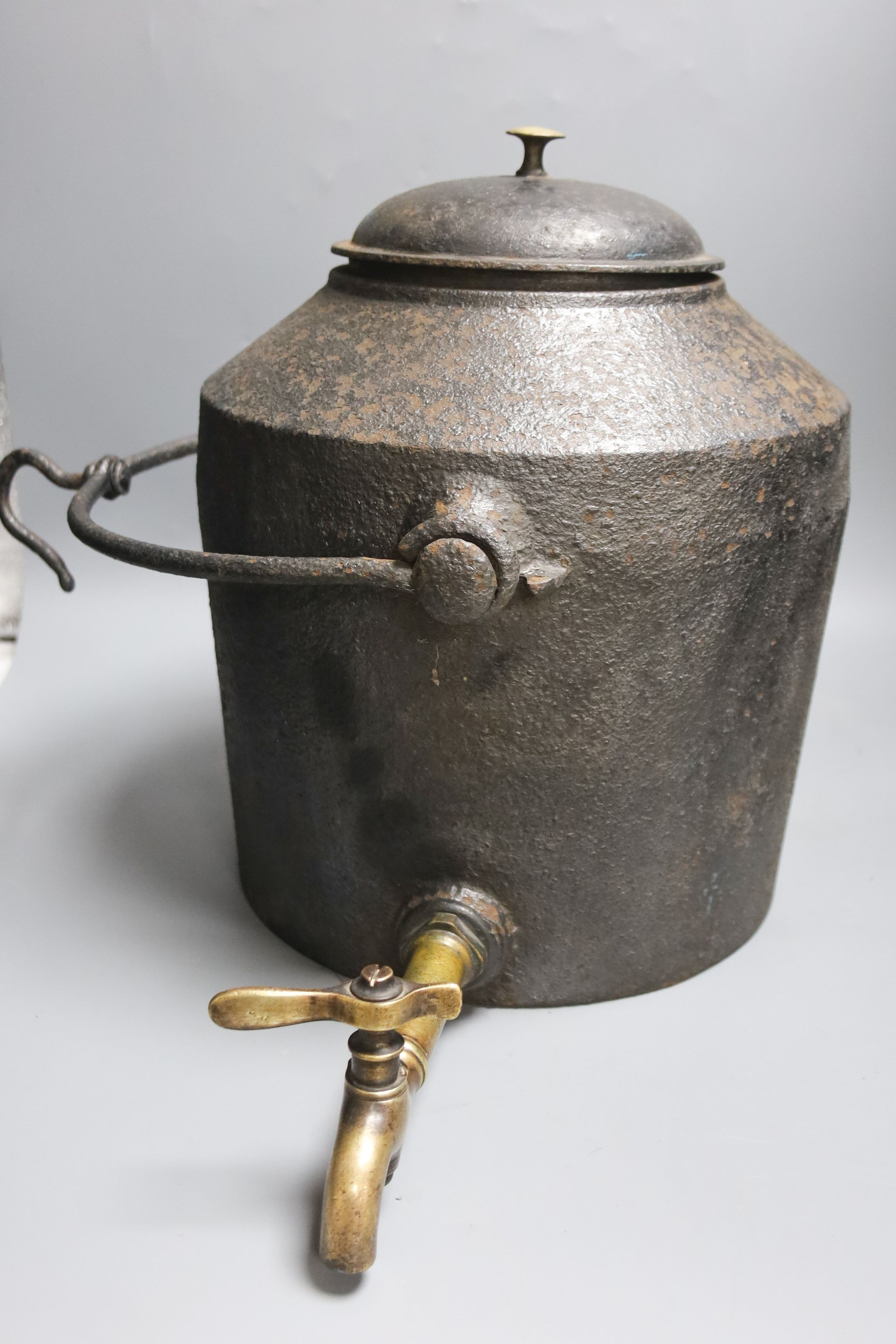 A 19th century tooth extractor, boot pulls, military knives, telescope, leather ledger and iron kettle